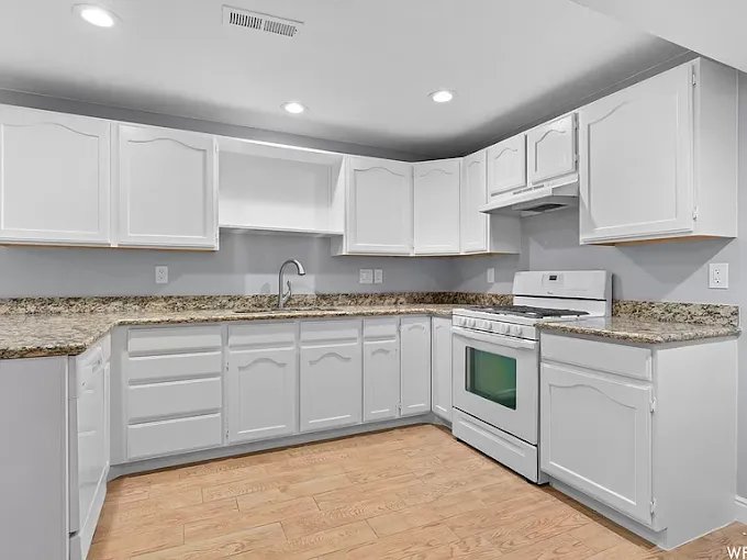 Freshly painted white kitchen cabinets