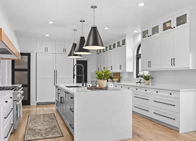 Kitchen with white island by Godspeed Services