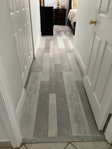 Laminate and LVP flooring installed in a hallway
